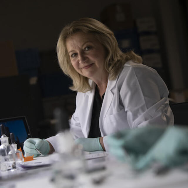 Carla Dove in her lab. Photo courtesy of the Smithsonian Institution