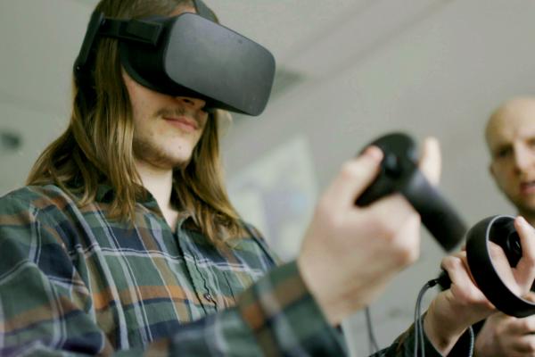A MEGL student uses a VR headset