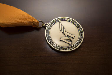 Faculty Excellence Award medal