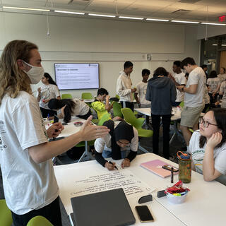 After moving into the Mason student dorms, ice breaker activities including a scavenger hunt helped participants build relationships while adding to their understanding of quantum. This picture from the group’s scavenger hunt shows their illustration of superposition.