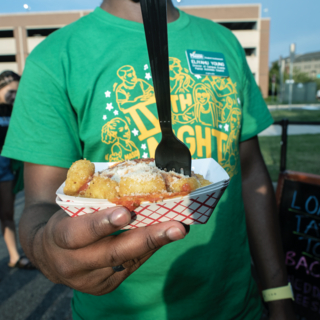 Image of student with food truck snacks