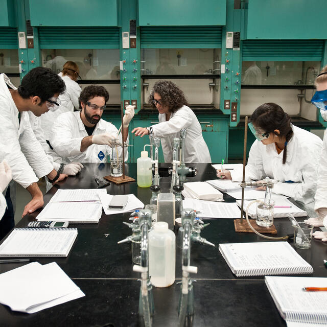 Students and professor in chemistry lab
