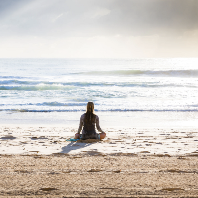 Woman sitting on the beach