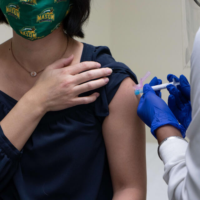 Woman receiving vaccination
