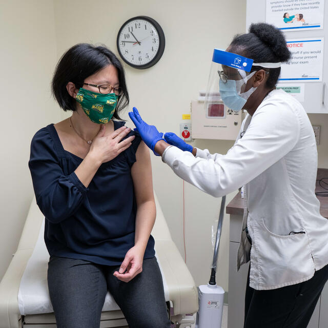 Woman receiving vaccination