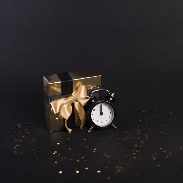 Gift box and a clock - the gift of time