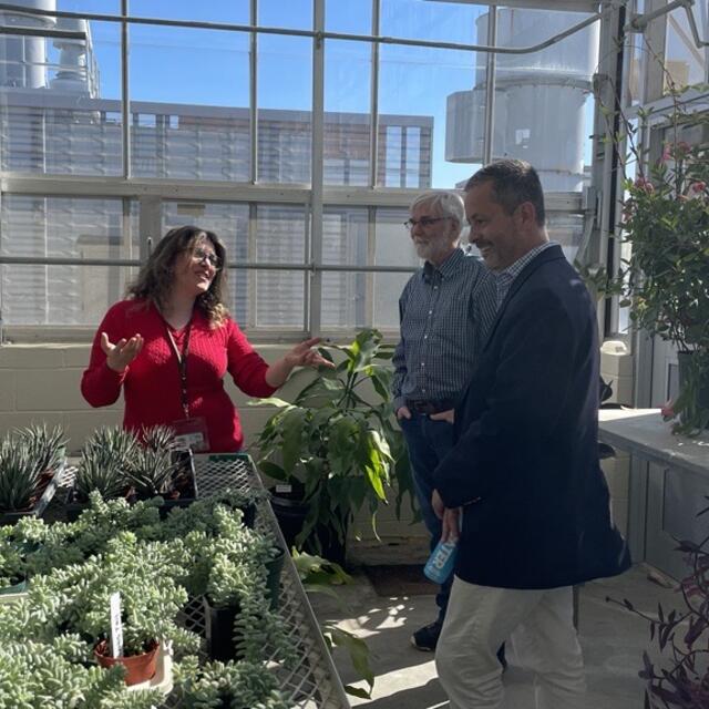 Provost Antony taking a tour of the greenhouse.