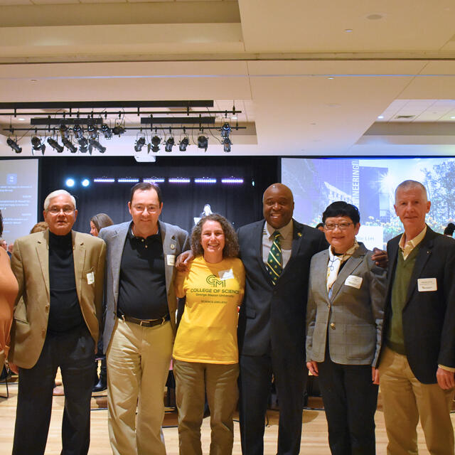 Faculty and staff celebrating milestone years at the 2024 Green and Gold Day.