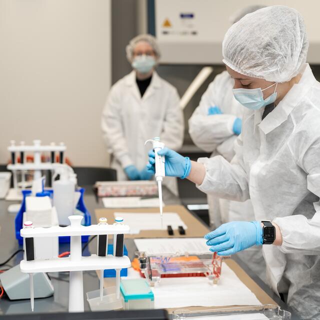 Student in lab gear in new LSEB lab
