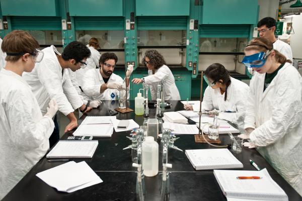 Students and professor in chemistry lab