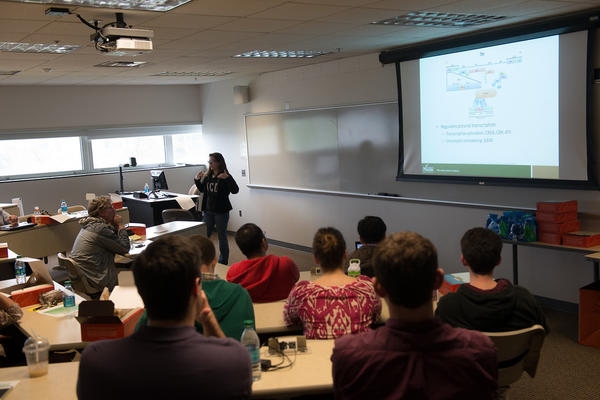 School of Systems Biology students present research to faculty and classmates on Research Day.