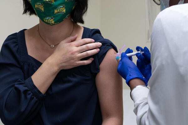Woman receiving vaccination