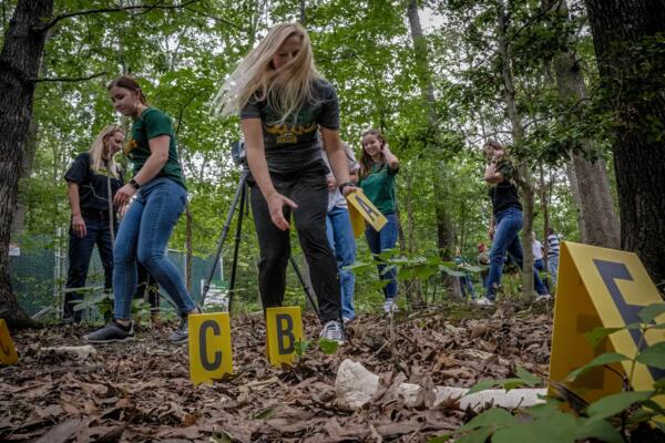 Students prepare a “crime scene” (Bill O'Leary/The Washington Post)