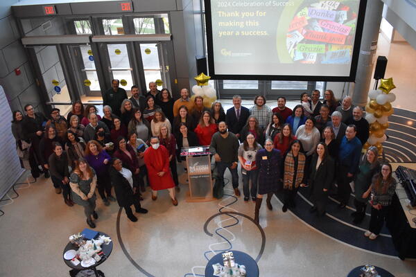 Faculty and staff smile together at the Celebration of Success 2024