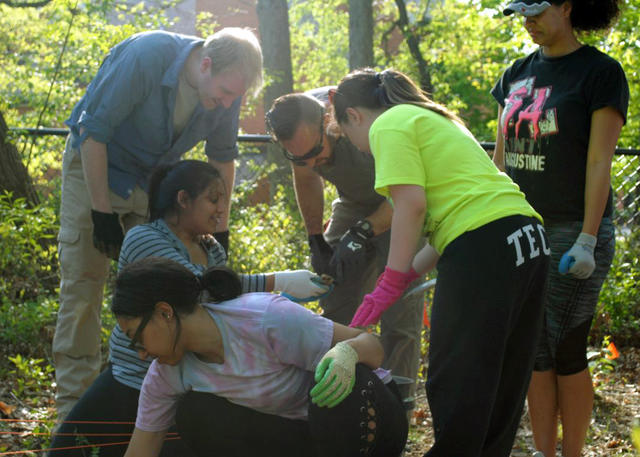 Students performing an outdoor excavation in Advanced Crime Scene Analysis