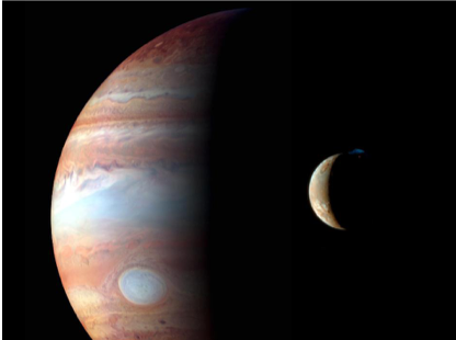 Figure 2. New Horizons image of the giant planet Jupiter (background) with its moon Io (to center right), taken during the spacecraft flyby in February 2007. Courtesy NASA/New Horizons.