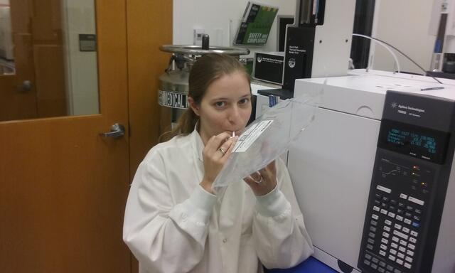 Researcher Allyson Dailey demonstrating how breath samples are collected. 