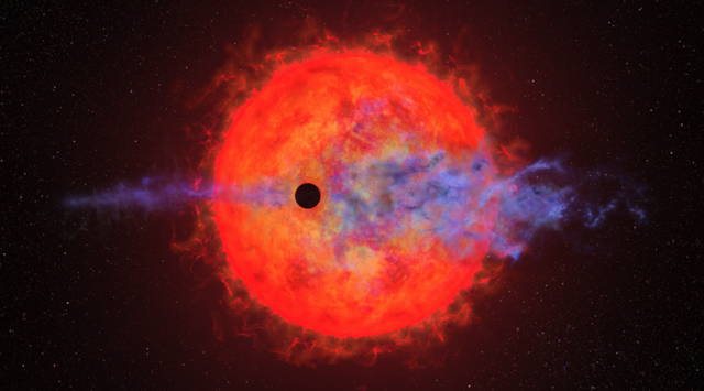This artist's illustration shows a planet (dark silhouette) passing in front of the red dwarf star AU Microscopii. The planet is so close to the eruptive star a ferocious blast of stellar wind and blistering ultraviolet radiation is heating the planet's hydrogen atmosphere, causing it to escape into space. Four times Earth's diameter, the planet is slowly evaporating its atmosphere, which stretches out linearly along its orbital path. This process may eventually leave behind a rocky core. The illustration i