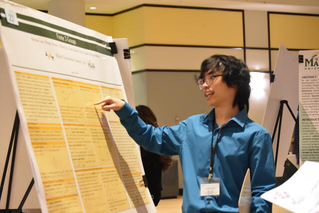 Student presenting their research at the 2024 Undergraduate Research Colloquium