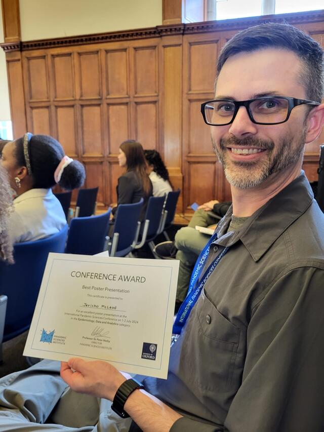 Jericho McLeod smiles with his award certificate for best poster. 