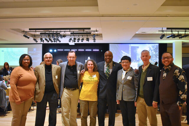 Faculty and staff celebrating milestone years at the 2024 Green and Gold Day.