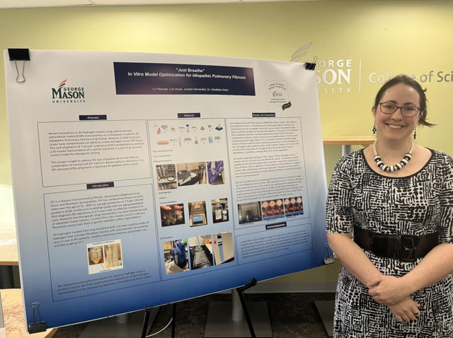 Liz Replogle stands with her research poster. She presented research she conducted with Professor Grant on idiopathic pulmonary fibrosis (IPF), a severe lung disease that causes scarring and thickening of lung tissue.
