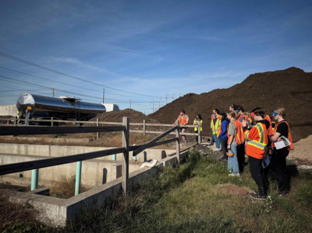 A milk hauler dumps excess or expired milk products, which Convertus uses in the composting process. The students noted that it made the area smell like vanilla creamer. Photo by Cindy Smith/College of Science