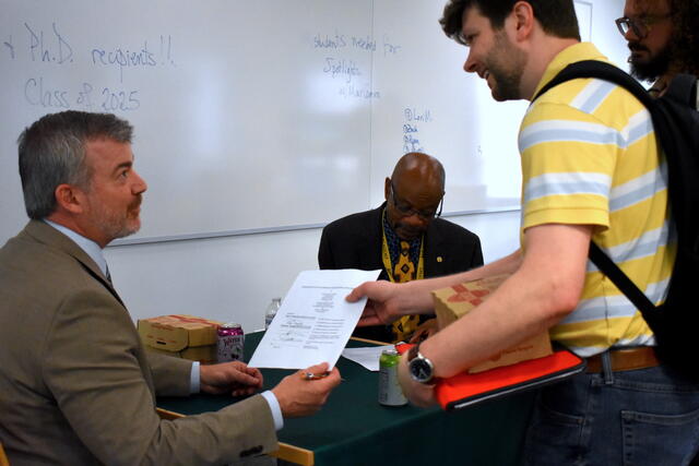 Cody W. Edwards signing off on PhD dissertations and MA theses..