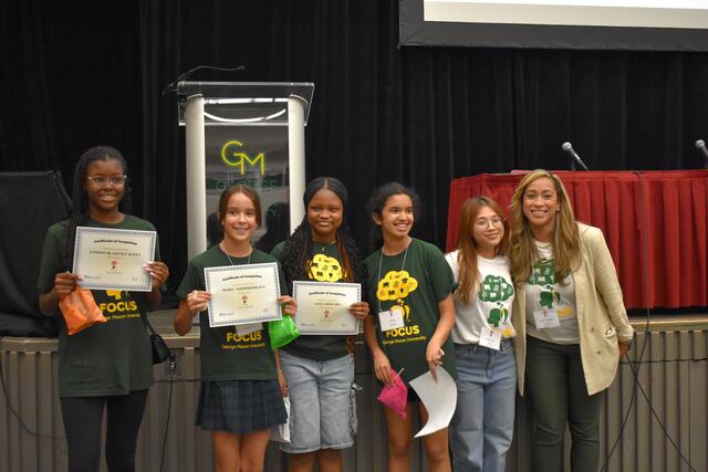 FOCUS participants pose their their certificates received at the completion of the program.