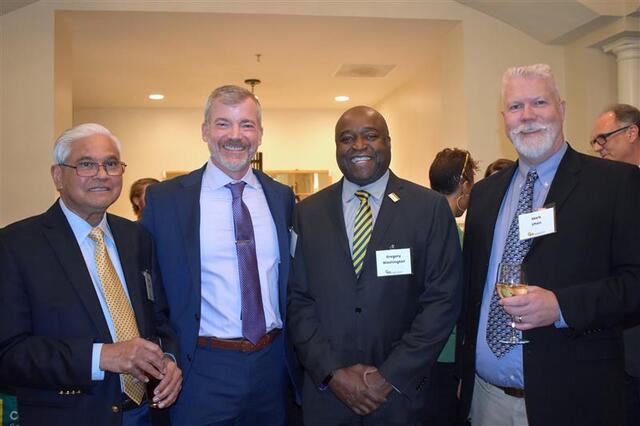 This one is (L-R) Jagadish Shukla, College of Science Dean Cody W. Edwards, President Gregory Washington, and AOES Chair Mark Uhen