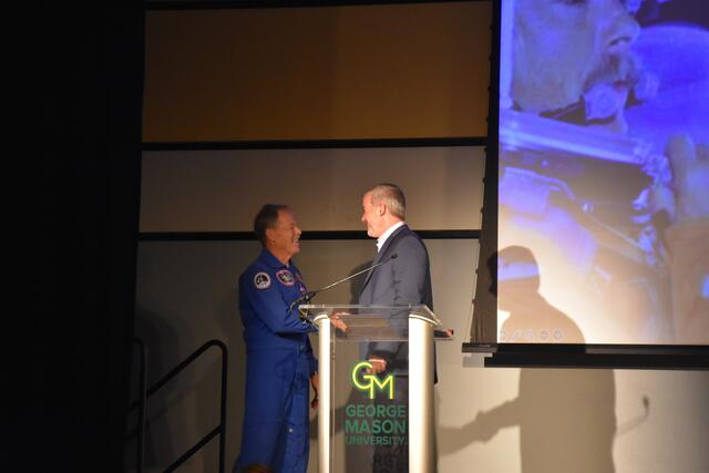 Dean Cody Edwards shaking hands with Captain Hoot Gibson. 