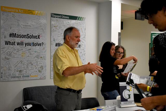 A faculty member speaks to students at ScienceConnect 2025