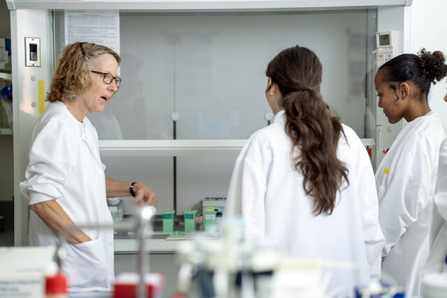 Ginny Espina in the lab with her ASSIP Interns