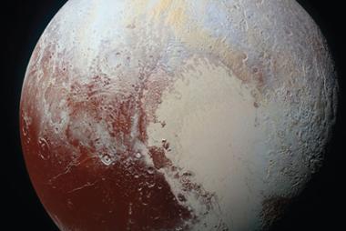 Figure 1. Full-disk image of Pluto showing its diverse surface composition, ranging from bright nitrogen ice glaciers to dark carbon-rich plains.  