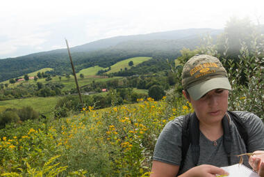 Picture of a SMSC student taking notes in a field near Front Royal, VA