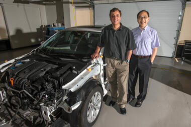 Professor and Director of CCSA Cing-Dao (Steve) Kan (R) and Associate Professor and Research Director of CCSA Dhafer Marzougui at the Center for Collision Safety and Analysis in Fairfax. Photo by Alexis Glenn/Creative Services/George Mason University