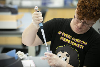 Student in lab with pipette