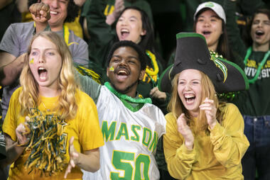 Students cheering at Mason sporting event