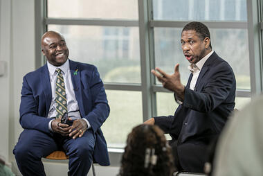 Dr. Hakeem Oluseyi speaks to President Gregory Washington at the first "Our Future Transformed" event