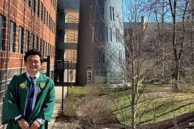 CDS graduate Oliver Yu stands in front of Mason's Observatory