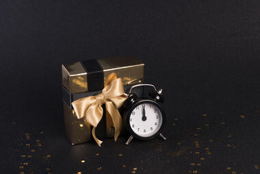 Gift box and a clock - the gift of time