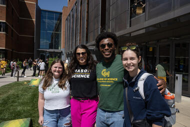 Students smile together outside Exploratory Hall at the 2024 ScienceConnect