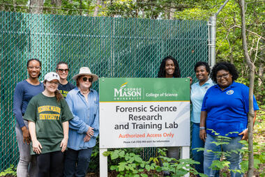 The SUNO contingent and George Mason's forensic science team—Georgia Williams, Mary Ellen O'Toole, Emily Rancourt, and Molly Kilcarr—stand in front of the Forensic Science Research Training Laboratory. Photo by Eduardo Macedo/Office of University Branding