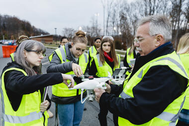 Forensic science professor Steven Burmeister teaching students using drone technology