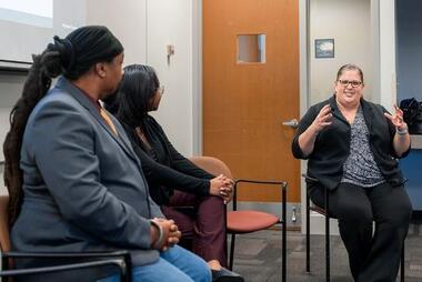 State Senator Stella Pekarsky (right) gives feedback on student presentations