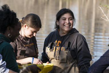 Student working in the local river as part of the Smithsonian-MasonSchool of Conservation.