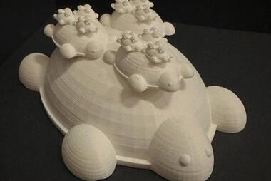 Image of 3-D printed Turtles on top of turtles (recursively)