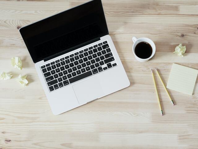 Image of laptop with coffee mug
